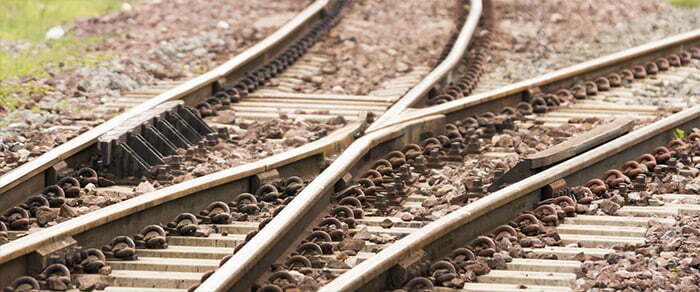 A close-up of a train track, rail junction