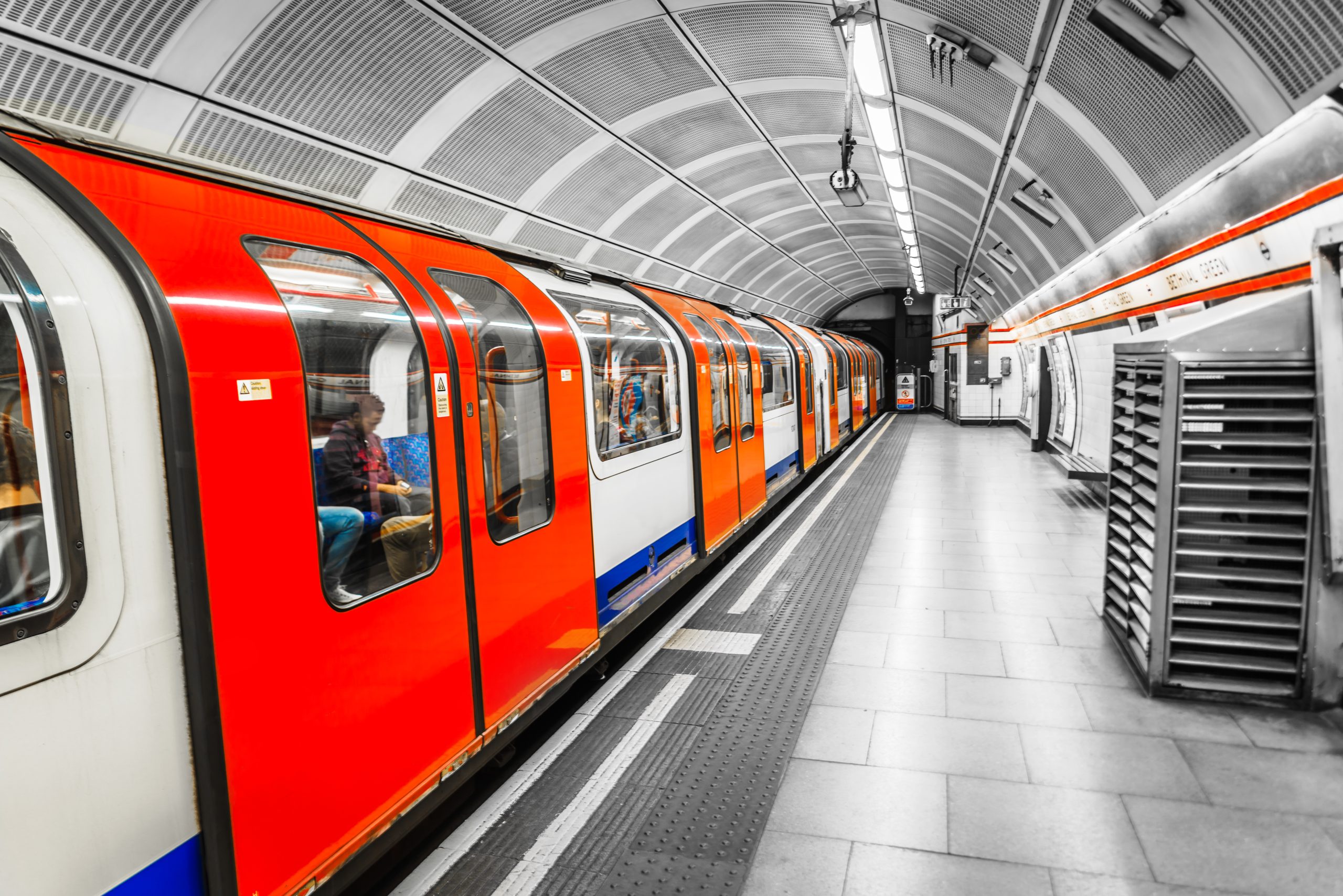 A London Underground train leaving the undeground train station