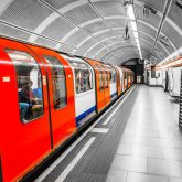A London Underground train leaving the undeground train station
